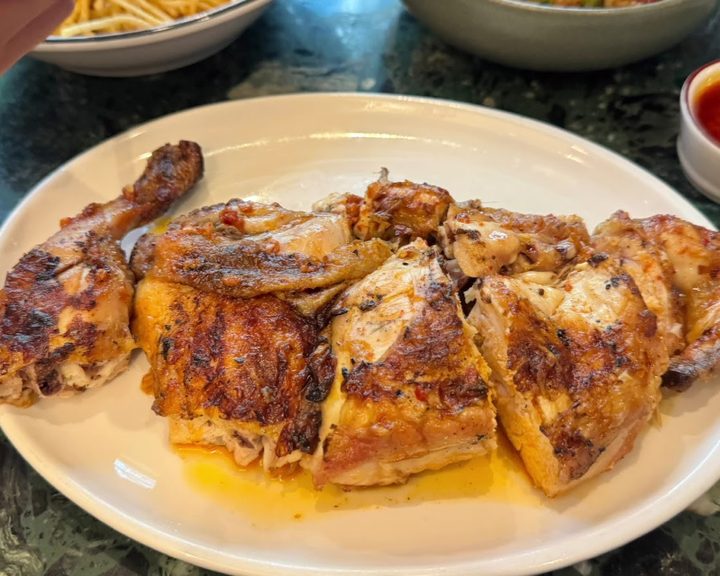 Charcoal-grilled piri-piri chicken at Casa do Frango Victoria