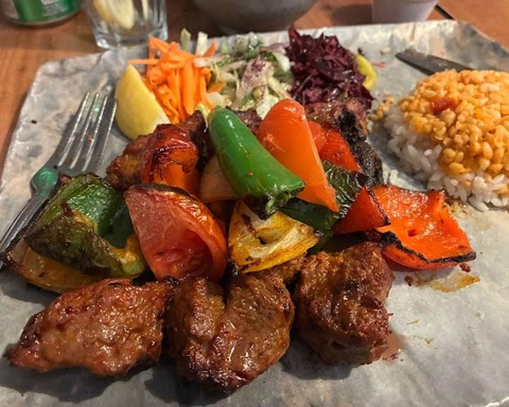 Charcoal-grilled meats, rice and salad at FM Mangal in Camberwell