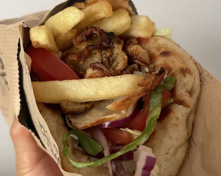 A filled Greek gyros pita at It's All Greek to Me in Paddington