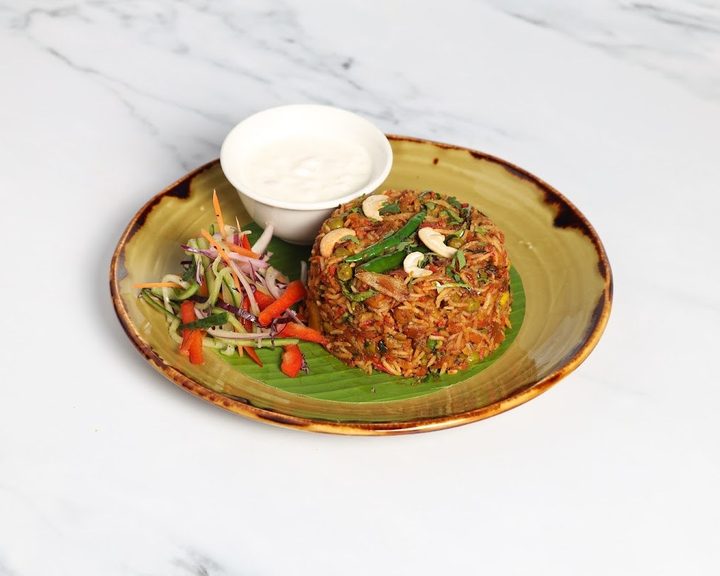 Sri Lankan noodle dish with salad at Papaya Ealing