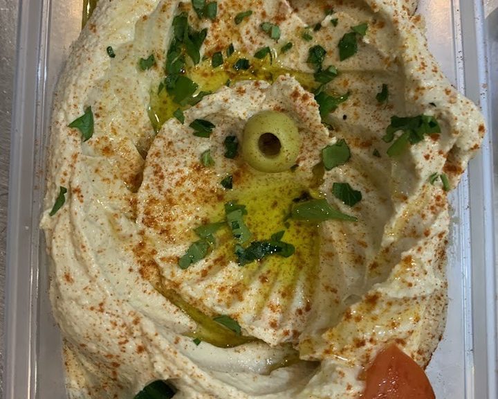 Creamy hummus with olive oil, herbs and flatbread at Shaam Nights in Cardiff