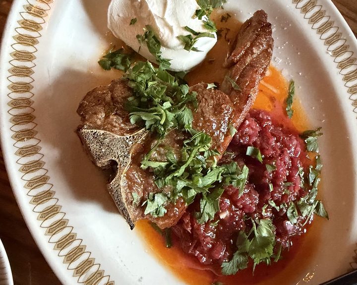 A plated dish with herbs and tomato sauce at The Plimsoll