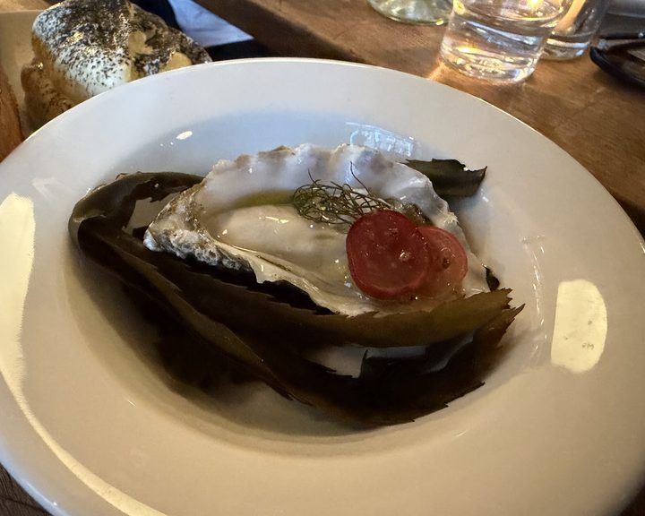 Oyster served over seaweed at Brat on Redchurch Street