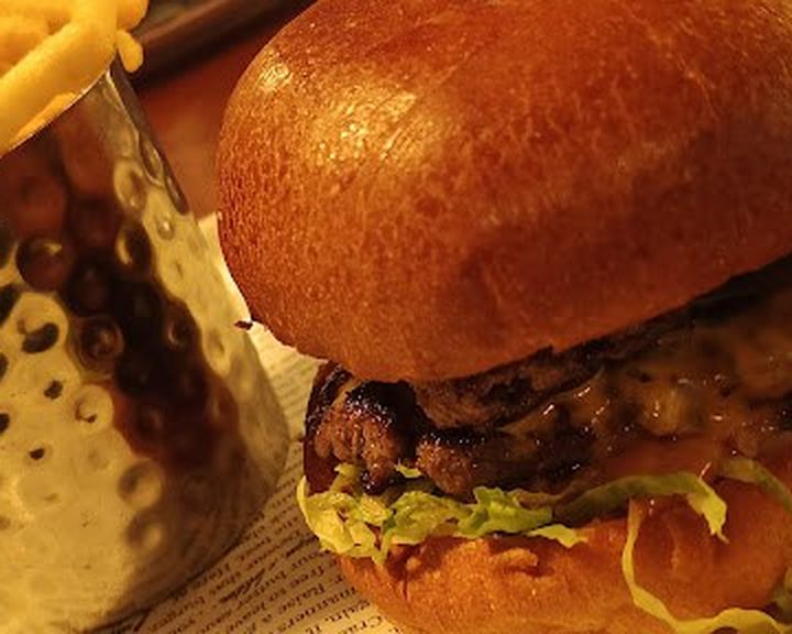 Beef burger with fries and sauce at Burger & Lobster Bread Street