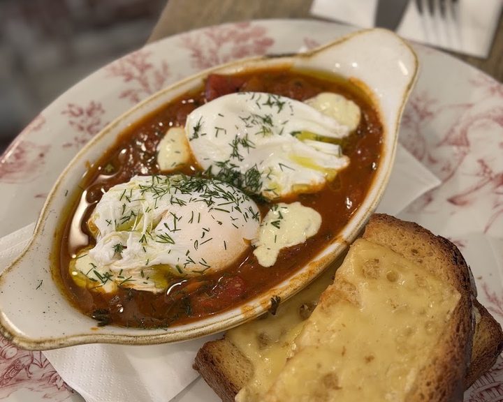 Brunch dish with eggs and bread at Eggbreak in Kensington