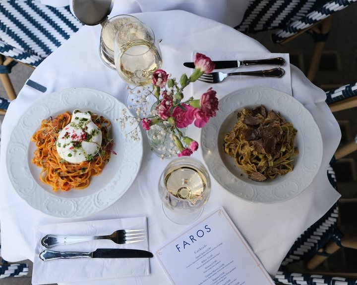Mediterranean dishes arranged on a table at Faros Holborn