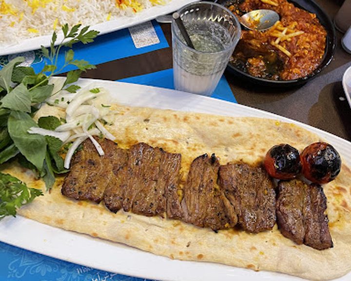 Persian rice, grilled meat and accompaniments at Mother Restaurant in Finchley