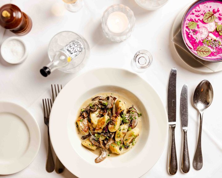 A carefully plated pasta dish at Ognisko Restaurant