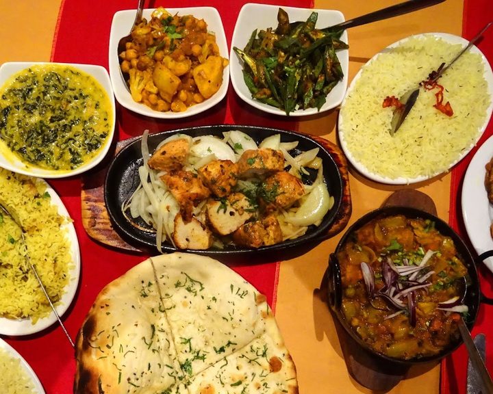 Indian curries, rice and side dishes at Taste of Nawab in Muswell Hill