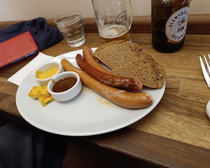 Sausages with dark bread and mustard at Wally's Delicatessen in Cardiff