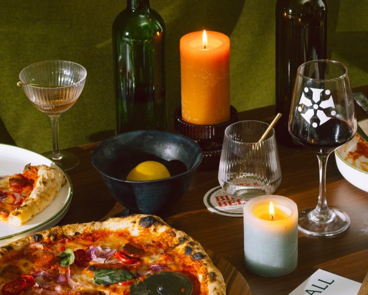 Pizzas and Italian small plates on a table at Amelia Hall Belfast