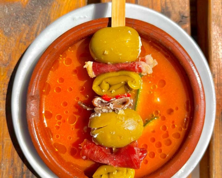 A Spanish chorizo and pepper skewer with sauce at Curado Bar