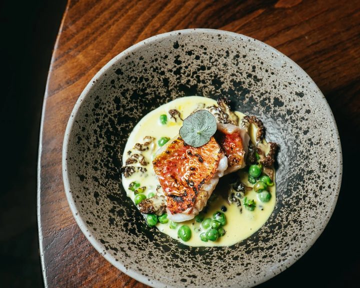 Fire-led fish dish with peas at Ekstedt at The Yard