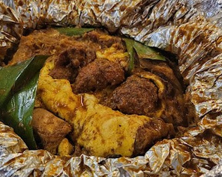 A banana-leaf Keralan meat and potato dish at Koottaan Curry Club in Cathays