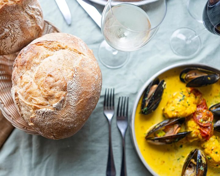 Mussels in a golden sauce with fresh bread at Mia Italian Kitchen Dalry