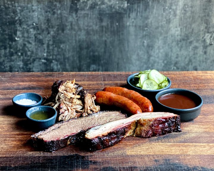 Smoked brisket, sausage, pulled pork and pickles at Smokestak