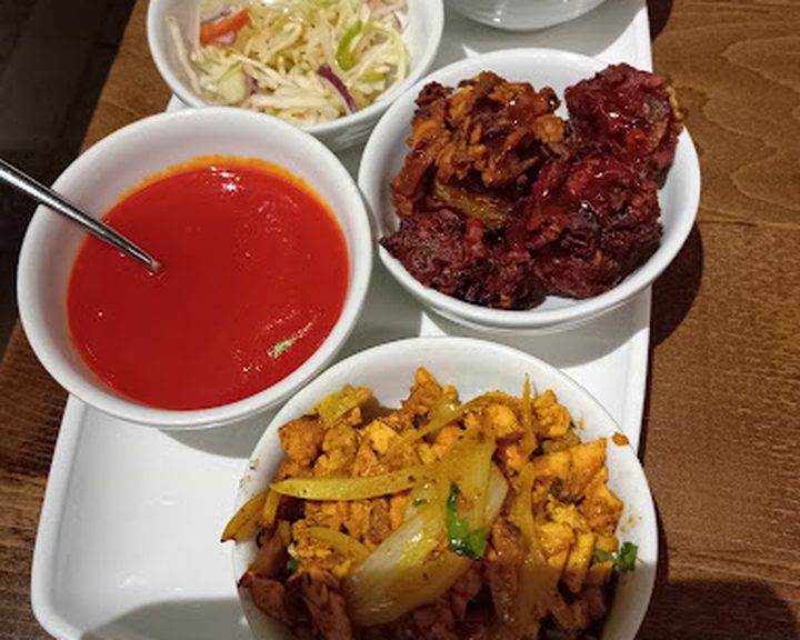 An Indian platter with curry, rice and accompaniments at The East Bengal