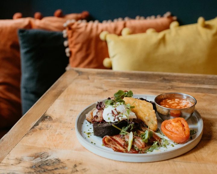 A brunch plate with eggs and seasonal accompaniments at The Pantry Stockbridge