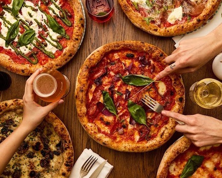 Italian pizzas with tomato, cheese and basil at Gloria Shoreditch
