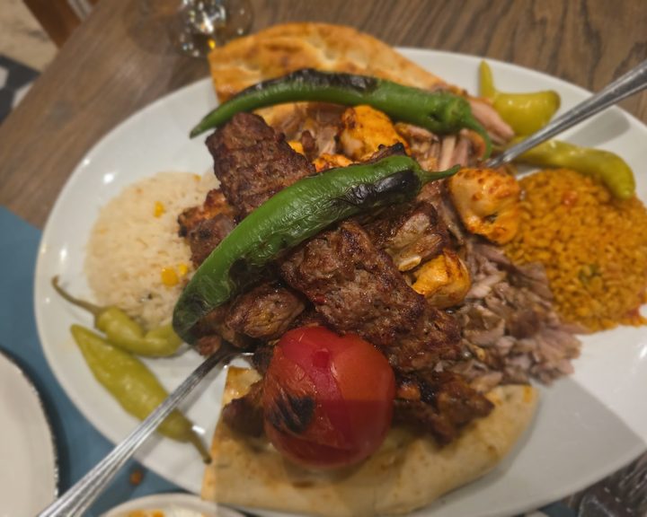 Charcoal-grilled chicken and lamb with rice and salad at Gokyuzu Green Lanes