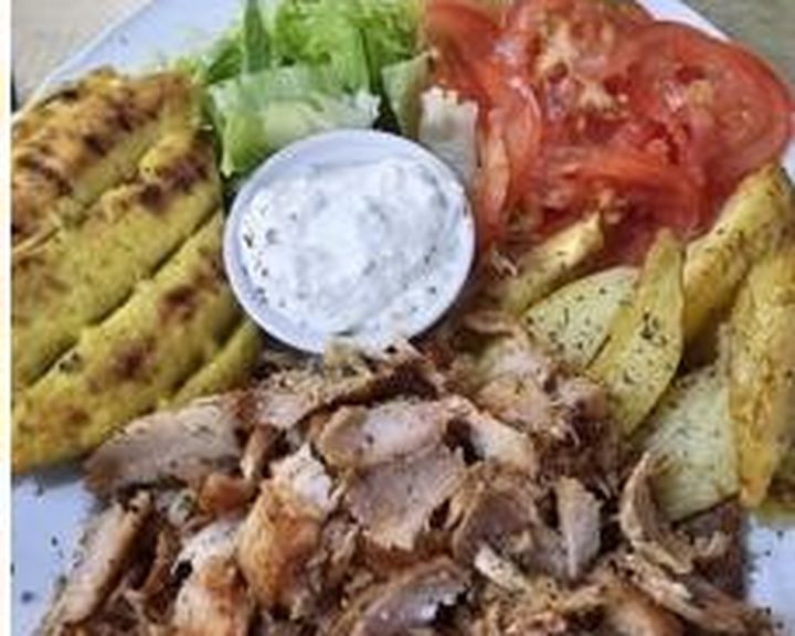 A Greek gyros plate with grilled meat, salad and pita at Ola Kala in Edinburgh