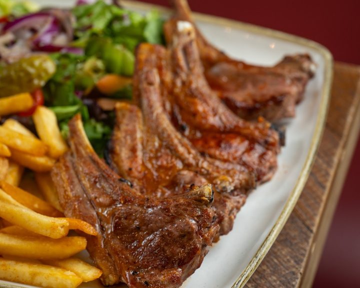 Charcoal-grilled steak with fries at Stone & Grill