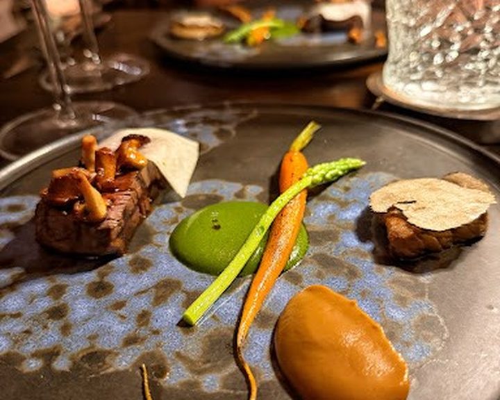 Modern tasting-menu dish with meat, vegetables and sauces at The Muddlers Club Belfast