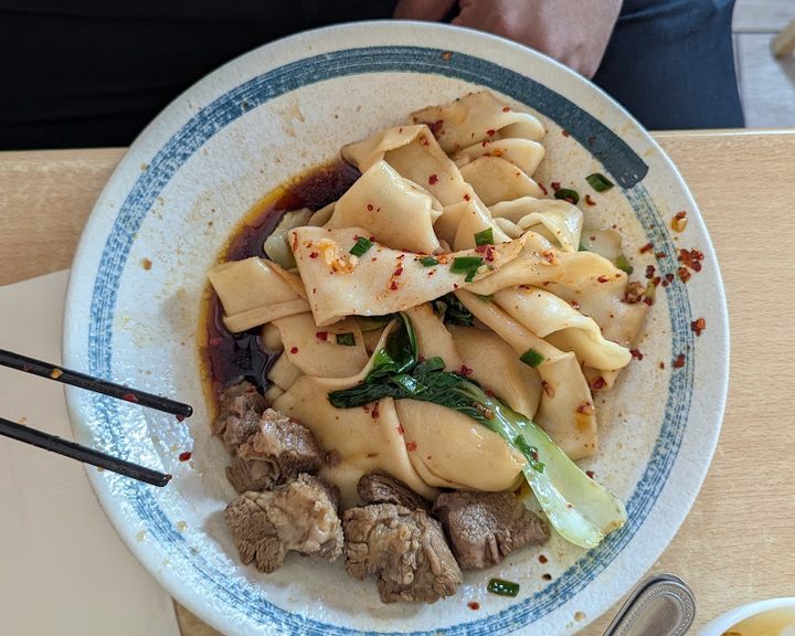 Hand-pulled belt noodles with beef at Xi'an Impression