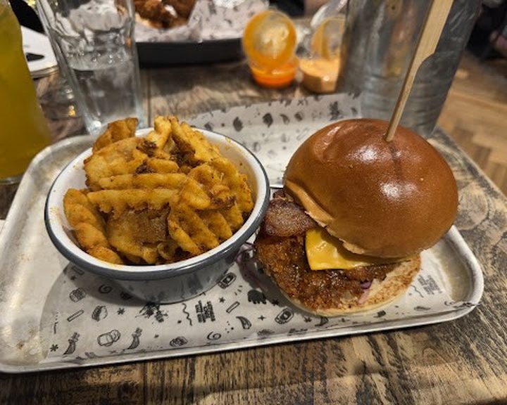 Burger, fries and sauce at Fat Hippo Edinburgh