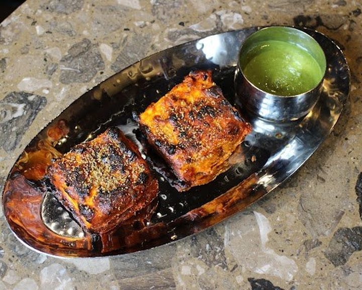 Charred fish tikka with green chutney at KOKUM in East Dulwich