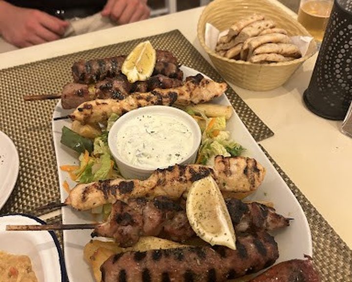 A mixed Greek charcoal grill with flatbread and tzatziki at Maria’s Greek Taverna in Cathays