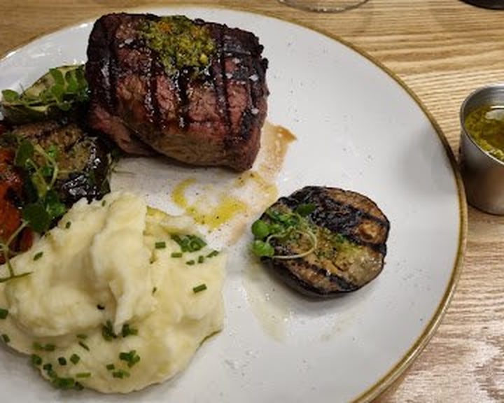 Argentine steak with accompaniments at Santa Maria Del Sur