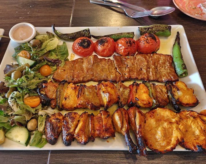 Persian kebab, rice and grilled tomato at Yasmin Restaurant in Fulham