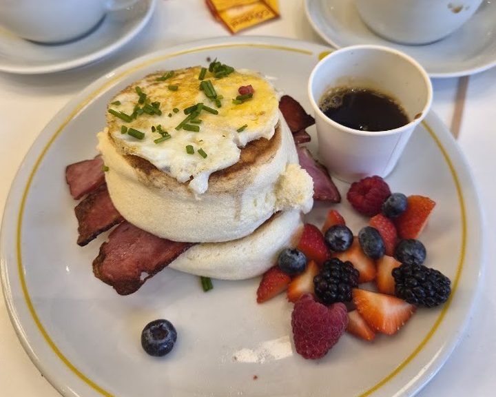 A savoury soufflé pancake stack with egg at Fluffy Fluffy Cardiff
