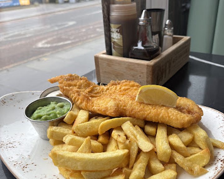 Battered fish, chips and mushy peas at City Restaurant in Edinburgh