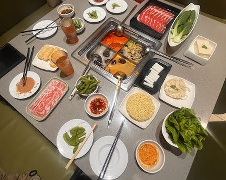 Hot-pot broths, sliced meat and vegetables at Haidilao Piccadilly