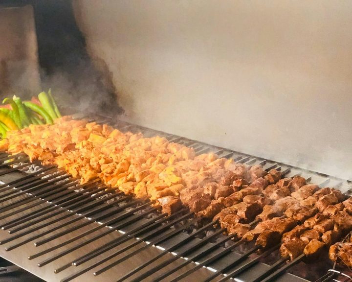 Turkish kebabs cooking over charcoal at Kezban Mediterranean Restaurant in Edinburgh