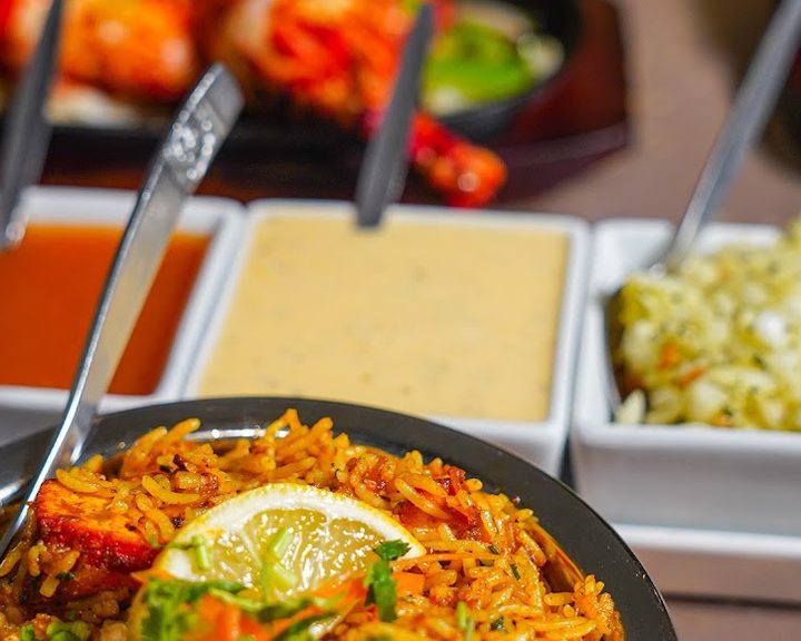 A fragrant rice dish with curries at Spice Village in Cardiff