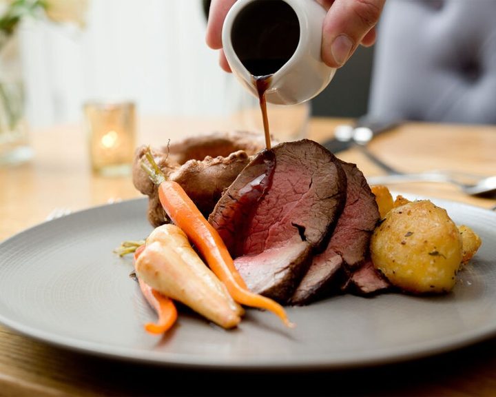 A British roast dinner with gravy at The Stablehand in Paddington