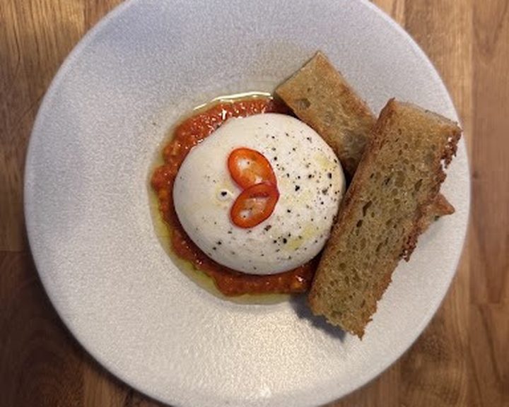 Burrata with pepper dressing and bread at tipo in Edinburgh