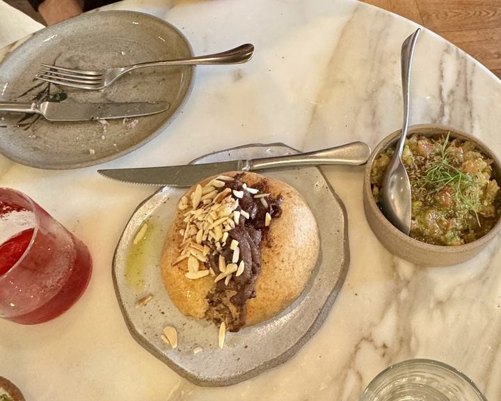 Palestinian sharing dishes at Akub in Kensington