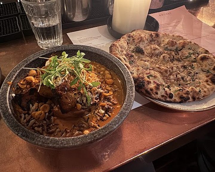 Modern Indian curry and flatbread at Kricket Soho