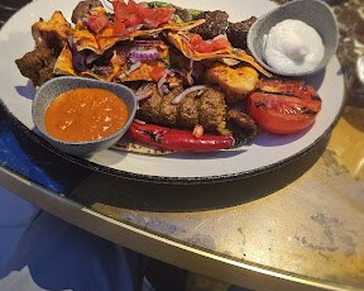 Lebanese mixed grill with accompaniments at Mezemiso