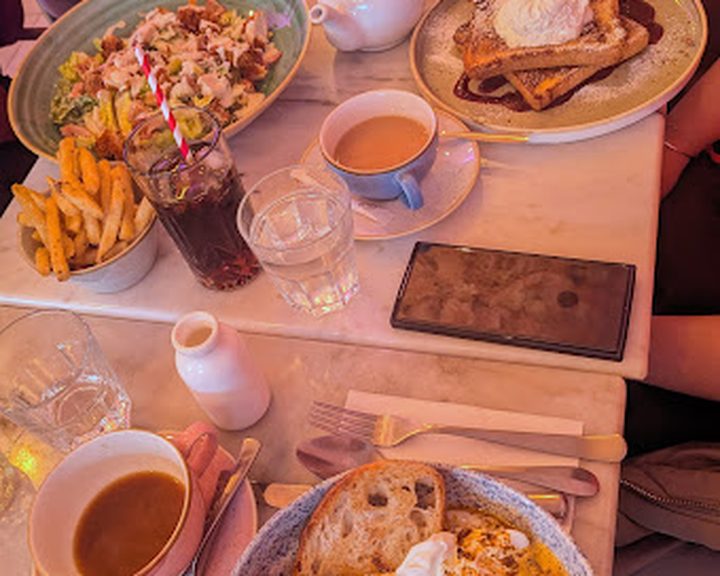 A table of sweet and savoury cafe dishes at Dilly and Dollys in Belfast