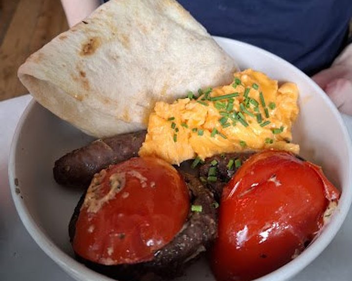 Eggs, toast, tomatoes and greens at Farm Girl South Kensington