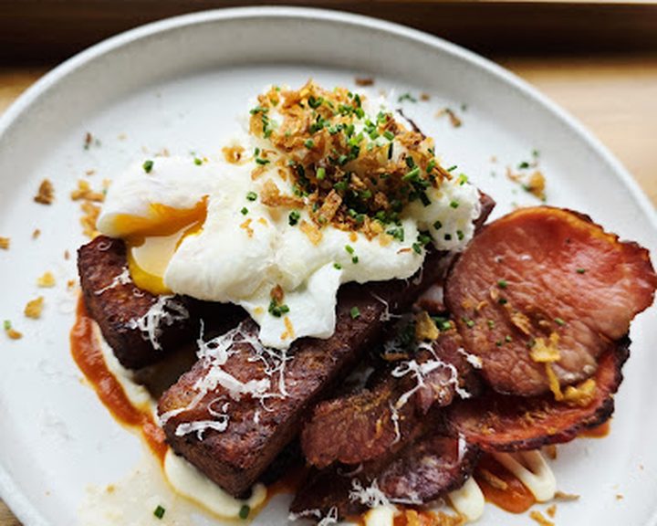 Poached eggs, bacon and potatoes at French Village on Lisburn Road