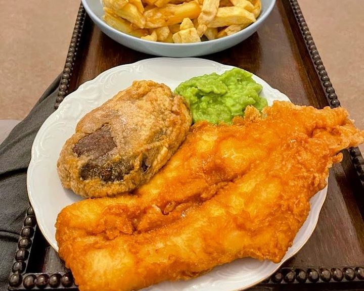 Freshly battered fish with chips and mushy peas from Gorgie Fish Bar