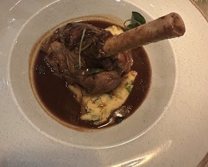 Slow-cooked lamb with mashed potato and red-wine sauce at La Petite Colline