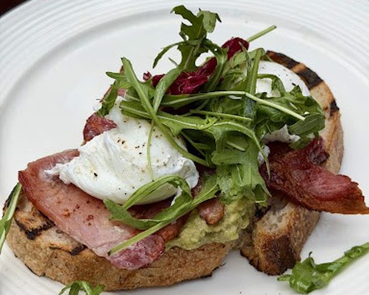 Poached eggs, bacon and greens on toast at Stock Kitchen and Bar Belfast