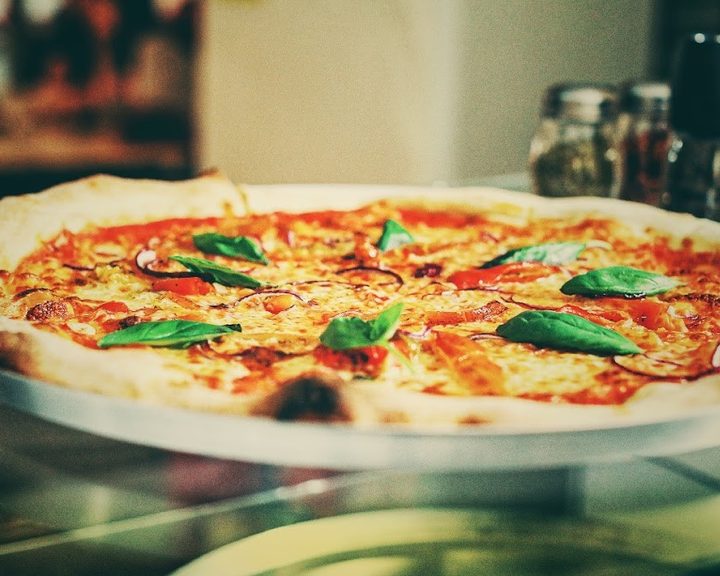 A basil-topped New York-style pizza at West Pizza in Pontcanna